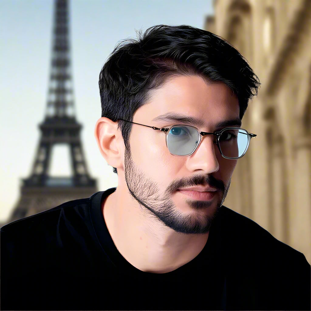 Man wearing eyeglasses with a neutral background