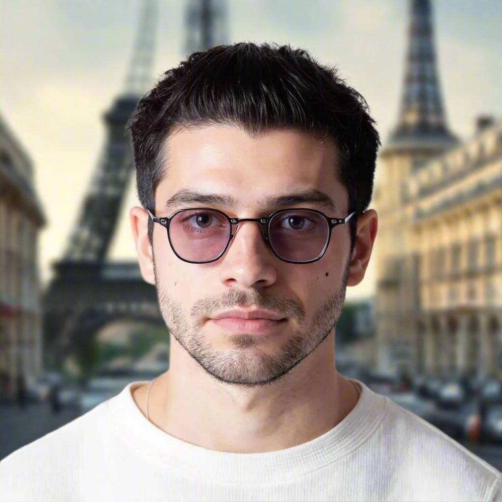 Man wearing glasses with a neutral background