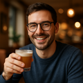a guy wearing my glasses type and having a drink